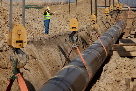 Pipe dream: workers at Germany’s port of Lubmin lower a section of pipeline into place as part of the Nord Stream gas link being built from Russia. Source: Getty Images/Fotobank