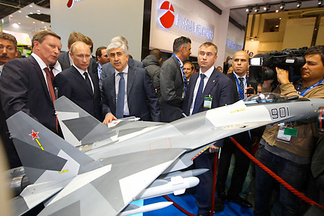 Russian Prime Minister Vladimir Putin (2ndL) visits the space dedicated to Russia at the Paris International Air Show on June 21, 2011 at the Le Bourget airport near Paris. Source: Reuters