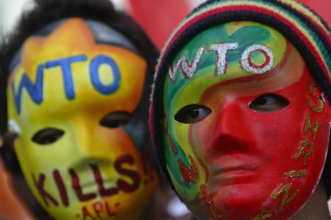 Filipino activists wear colourful masks during a rally against the economic liberalization policies pushed by the World Trade Organization. Source: AP/Mike Alquinto