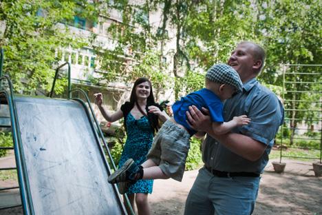 The Frolov family has fun in the yard near their apartment building. Source: Oksana Yushko   