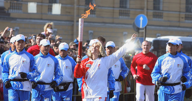 Olympic Champion, deputy chairman of Russian State Duma Svetlana Zhurova is taking part in 2008 Summer Olympic torch relay on the streets of Saint Petersburg.   Source: Kommersant