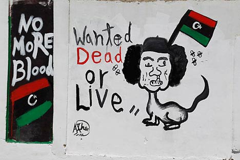 A caricature depicting Muammar Gaddafi is seen in Tripoli August 30, 2011.                  Source: Reuters/Vostock Photo