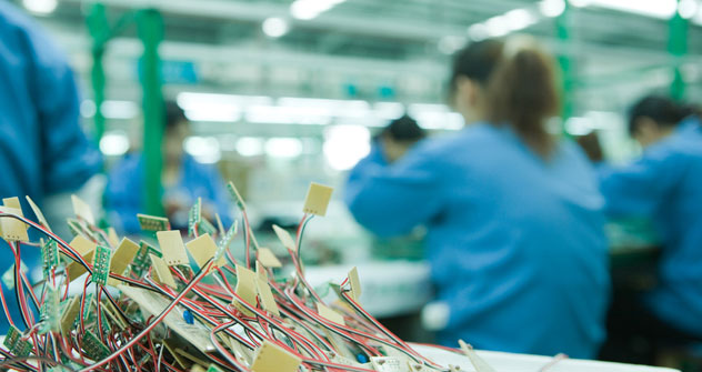 Componenti elettriche di circuiti stampati destinate alla produzione di computer. L’interscambio è tornato a crescere dopo la crisi internazionale. Foto: AFP/Eastnews