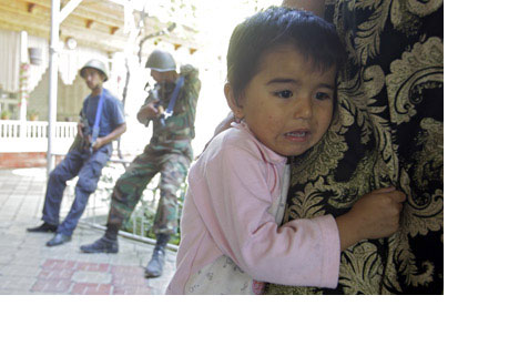 An Uzbek girl after Kyrgyz policemen conducted house-to-house searches in Kyrgyzstan