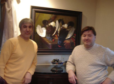Artist Ivan Kugach at his painting  with his friend artist Oleg Nefedkin