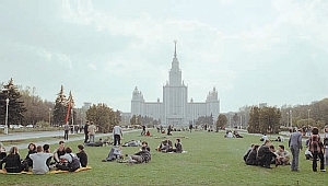 Students relaxing on the lawn in front of Moscow State University