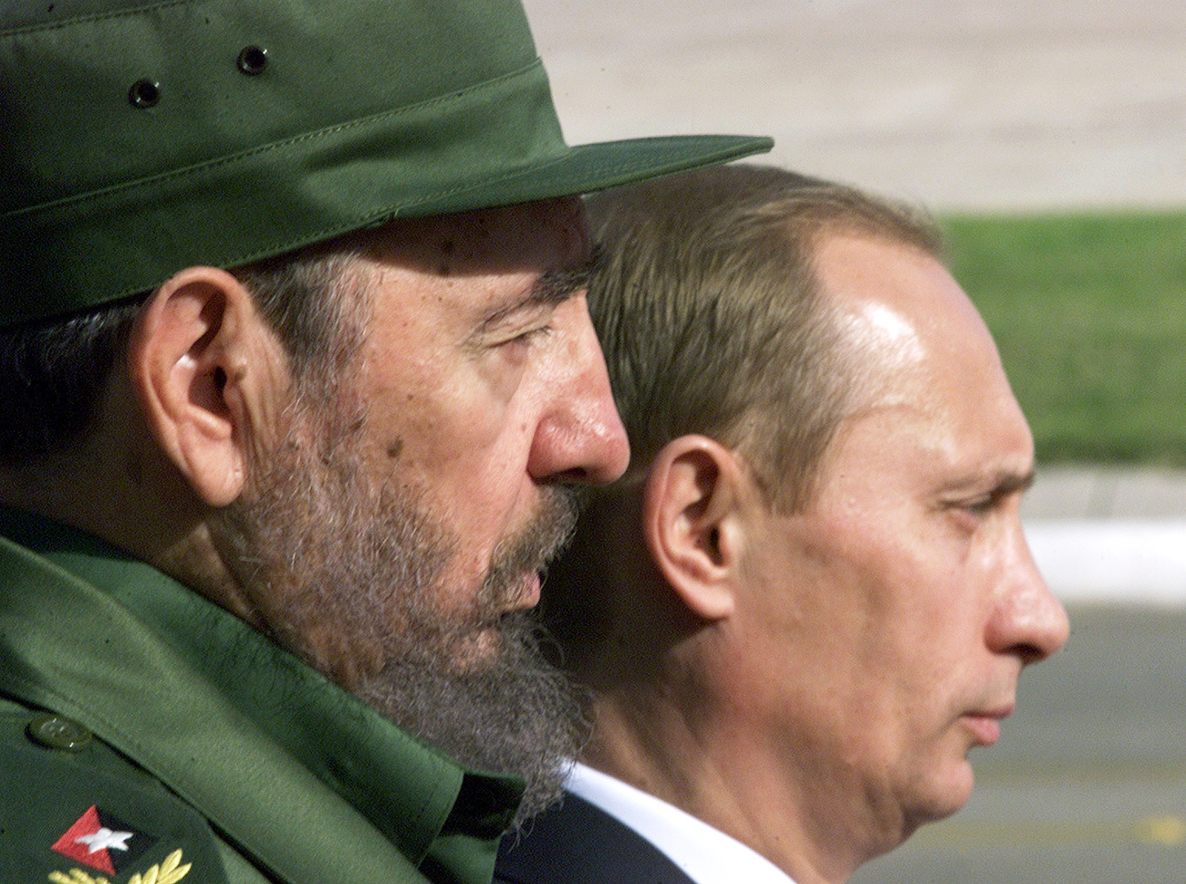 Russian President Vladimir Putin (R) and Cuban leader Fidel Castro stand side by side by during Putin's official welcoming ceremony outside Havana's Palace of the Revolution in December 2000. 