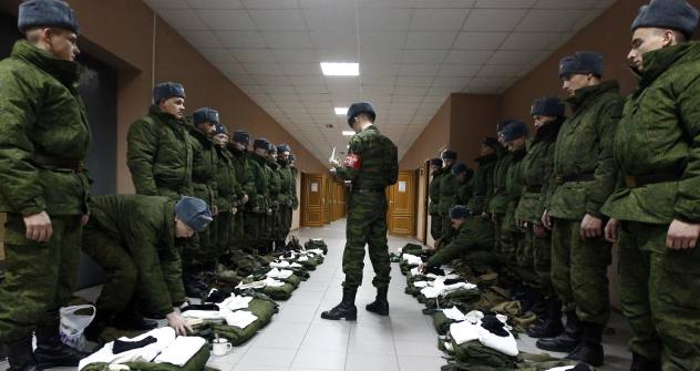 Although the military reform has been completed, a lot needs to be done. Pictured: Company CQ (Charge of Quarters) checking the recruit's outfit. Source: RIA Novosti / Ruslan Krivobok