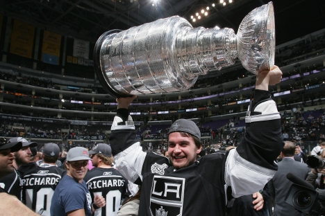 Andrei Loktionov #48 of the Los Angeles Kings lifts the Stanley Cup after the Los Angeles Kings defeated the New Jersey Devils 6-1 in Game Six of the 2012 Stanley Cup Final at the Staples Center on June 11, 2012 in Los Angeles, California. Source: Ge