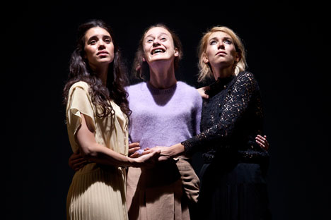 The Young Vic’s brand new “Three Sisters” abandons the traditional grammar of Chekhovian parasols and antique furniture in favor of tattoos and tracksuits, handbags and high heels. Source: Press Photo / Simon Annand. 