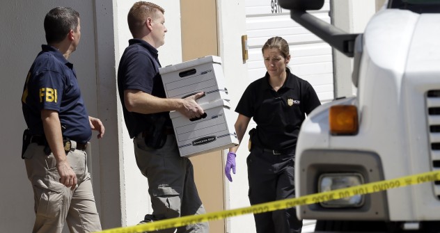 FBI agents carry boxes out of Arc Electronics Inc. on Oct. 3, 2012 in Houston. A Kazakhstan-born businessman was charged in the U.S. with being involved in a recent spy scandal between Russia and the U.S. Source: AP Photo / David J. Phillip