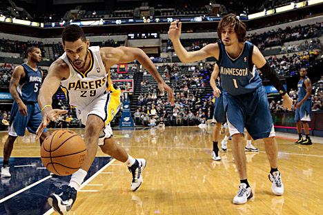 Indiana Pacers forward Jeff Pendergraph, left, chase down a loose ball in front of Minnesota Timberwolves guard Alexey Shved during the second half of a preseason NBA basketball game on Oct. 12 in Indianapolis. The Pacers won 96-91. Source: AP