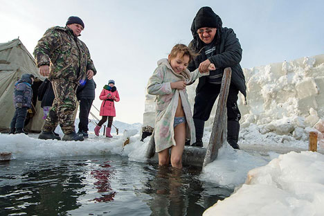 Russians all over the country was diving into the frozen water on Jan. 19. Source: AP