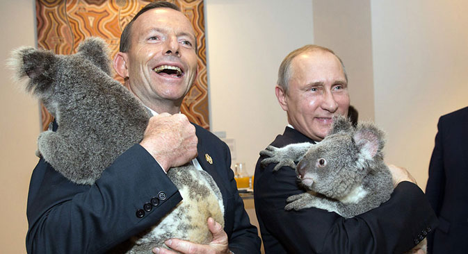 Australia's Prime Minister Tony Abbott (L) and Russia's President Vladimir Putin as they meet Koalas before the start of the first G20. Source: AFP PHOTO / East News