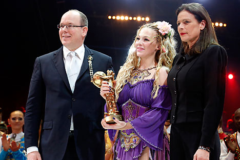 Russian artist Anastasia Fedotova-Stykan (center) with Prince Albert II of Monaco and his sister Princess Stephanie of Monaco after receiving a Golden Clown during the Award Gala evening of the 39th Monte Carlo International Circus Festival, on Jan. 20. Source: AP