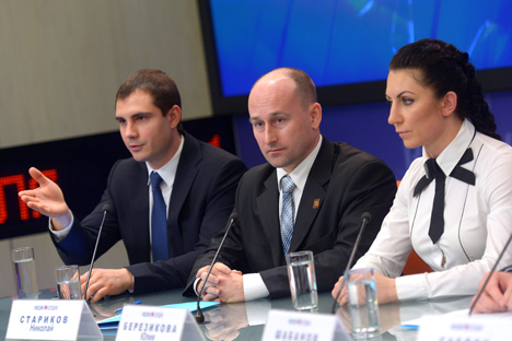 Members of the citizen action group of the Antimaidan public movement mixed martial arts world champion Yulia Berezikova (right), writer Nikolai Starikov (center) at a news conference "Contemporary Challenges: Revolutions, Illegal Acts; How to Protect Your Country From Collapsing." Source: Vladimir Trefilov / RIA Novosti