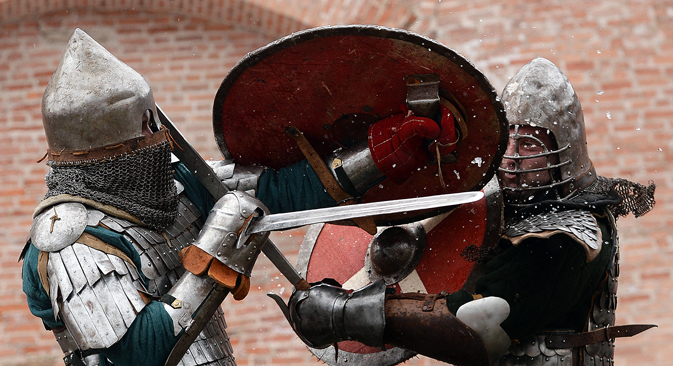 Participants in the Muster of Martial Retinues reenact a fight between warriors at the walls of the Novgorod Kremlin. Source:  Konstantin Chalabov / RIA Novosti