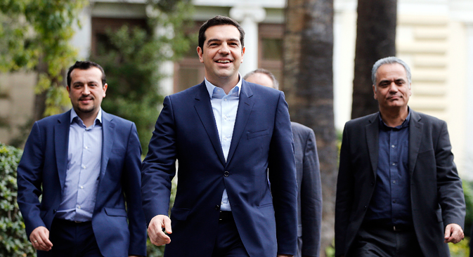 Greece's newly-appointed Prime Minister Alexis Tsipras (C) leaves the Presidential Mansion after his swearing-in ceremony as Greece's first leftist prime minister in Athens January 26, 2015. Source: Reuters