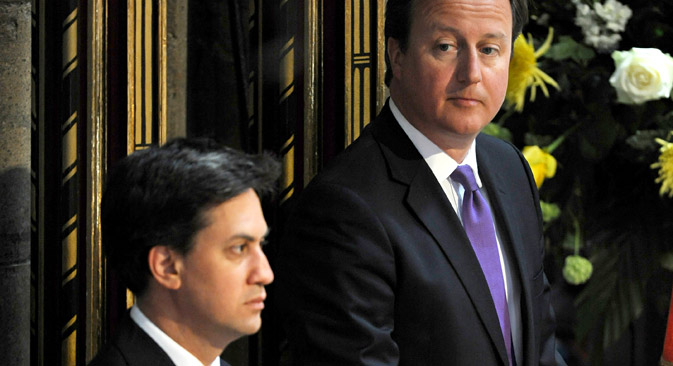 Both British PM David Cameron (r) and challenger Ed Miliband (l) are tough on their stance toward Russia. Source: AP