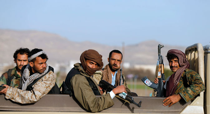 Houthi fighters ride a truck near the presidential palace in Sanaa. Source: Reuters