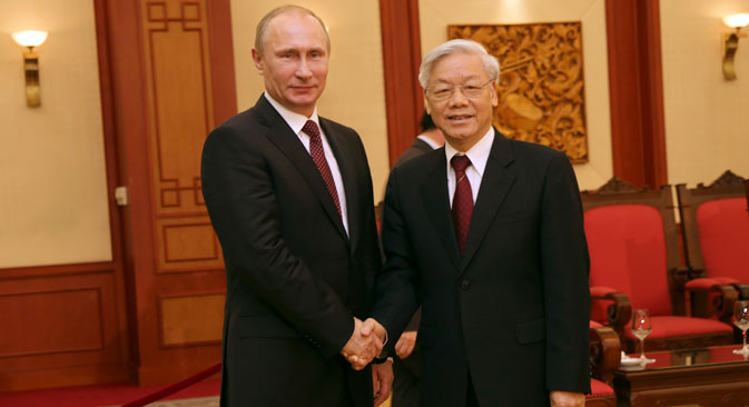Russian President Vladimir Putin (L) meets with General Secretary of the Communist Party of Vietnam Nguyen Phu Trong in Hanoi, capital of Vietnam.Source: AP