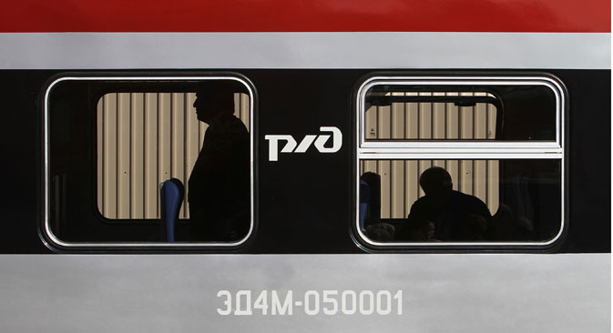 Visitors inspect the interior of an OAO Russian Railways locomotive displayed at the III International Rail Salon Expo 1520 in Scherbinka, Moscow region. Source: Getty Images