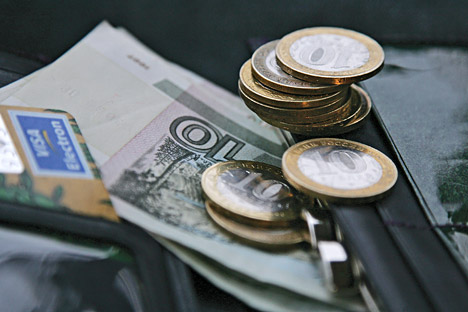 Para ahli memperkirakan, pada akhir 2014 nilai tukar rubel terhadap dolar AS bisa mencapai 37,50-38 rubel. Sumber: ITAR-TASS