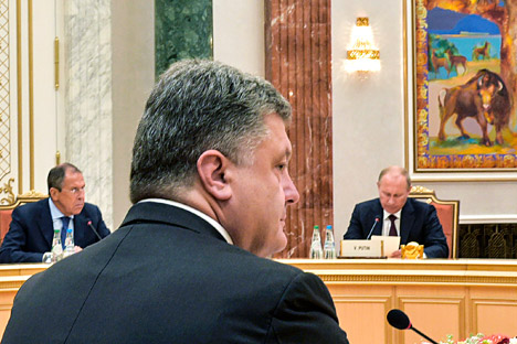 Layanan pers kepresidenan Rusia juga menjelaskan bahwa Putin dan Poroshenko telah menyepakati gencatan senjata sementara. Foto: Reuters
