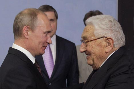 President Vladimir Putin and former United States secretary of state Henry Kissinger. Credit: Reuters.