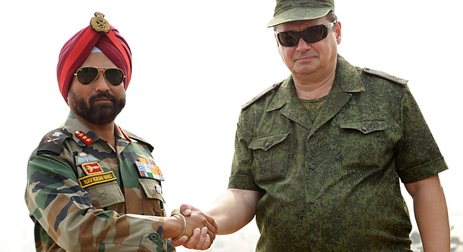 Russia's Lt. General, Alexy Zovizion (R), Chief of Staff (CoS) of the 36th Army and Indian's Army 10 Corps Commander Lt Gen, NS Ghei , shake hands after the INDRA 2013 joint Indo-Russia joint military drill at the Mahajan Field Firing Range in Rajasthan. Source: AFP PHOTO/ Sam PANTHAKY