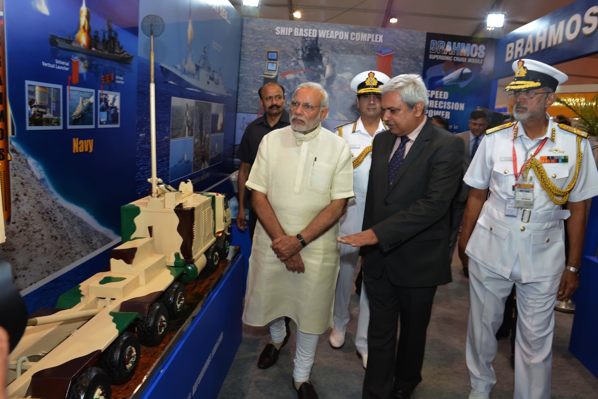 Narendra Modi was briefed about the BrahMos supersonic cruise missile system by Cdr. Ashotoosh Mehra (C).