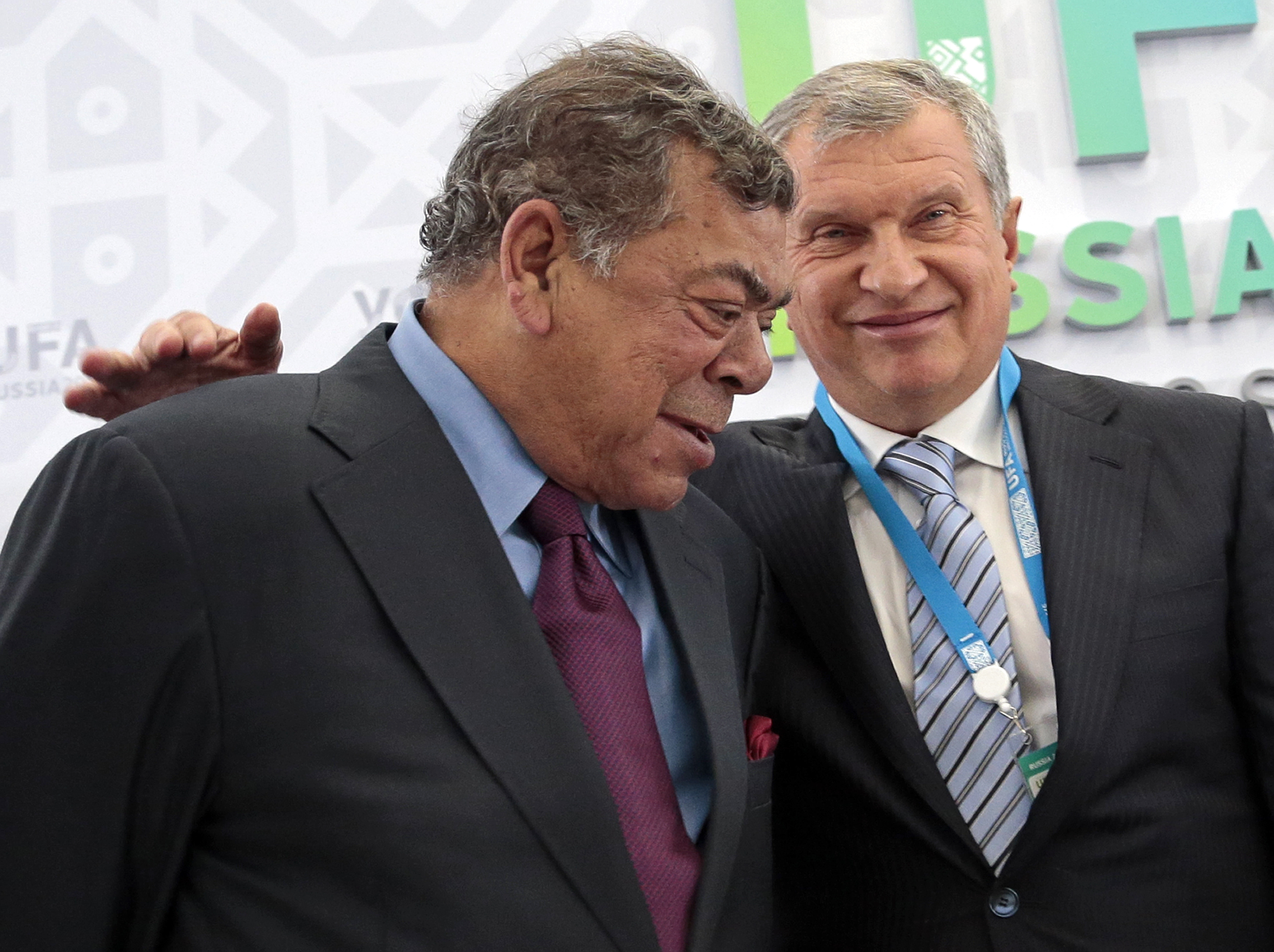 Shashi Ruia of India, chairman and co-founder of Essar Group, left, and Igor Sechin Rosneft CEO.