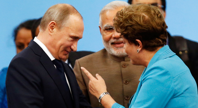 Il Presidente russo Vladimir Putin con il Presidente brasiliano Dilma Rousseff (Foto: Reuters)