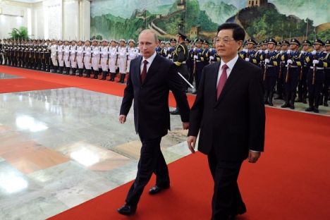 Владимир Путин и његов кинески колега Ху Ђинтао планирају да повећају сарадњу. Извор: Reuters / Марк Релстон.