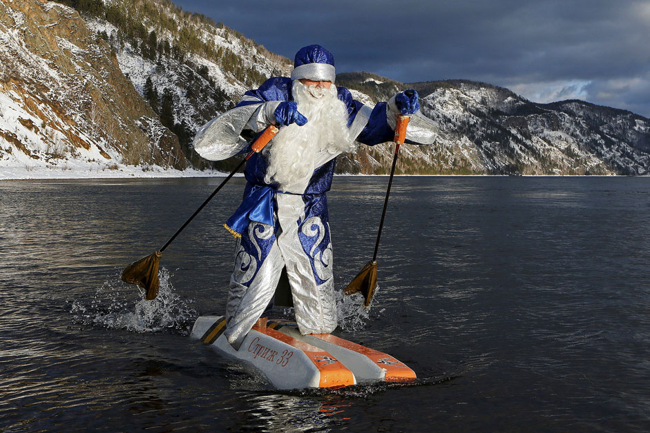 Nikolai Vasilyev, 62, dressed as Father Frost, Russian equivalent of Santa Claus, water-skis along the Yenisei River outside Siberian city of Krasnoyarsk, Russia.